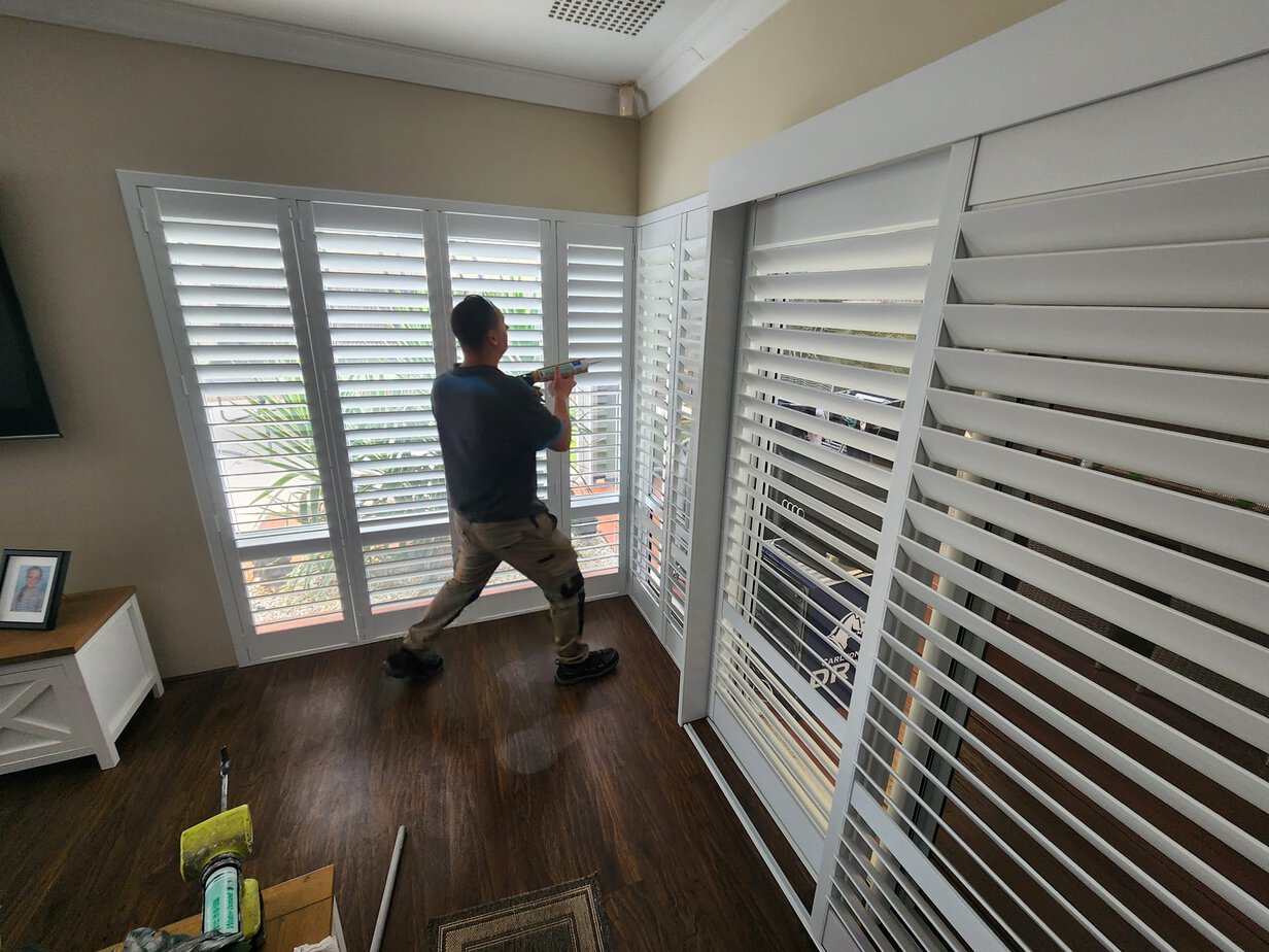 at work installing plantation shutters in Ridgewood